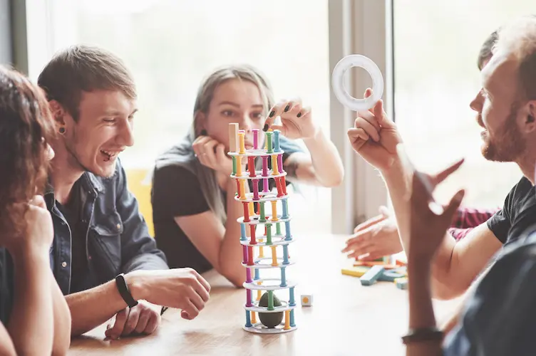 family playing board game