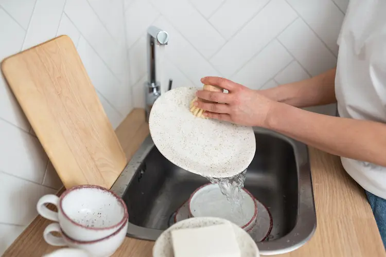 hand washing dishes