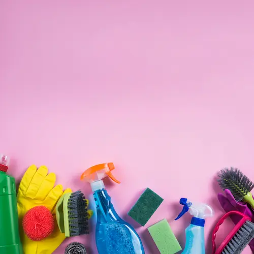 woman with cleaning gloves and apron looking at messy house 

spring cleaning day
