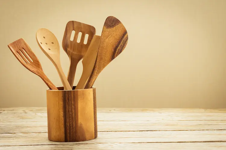 wooden spoons in wooden canister