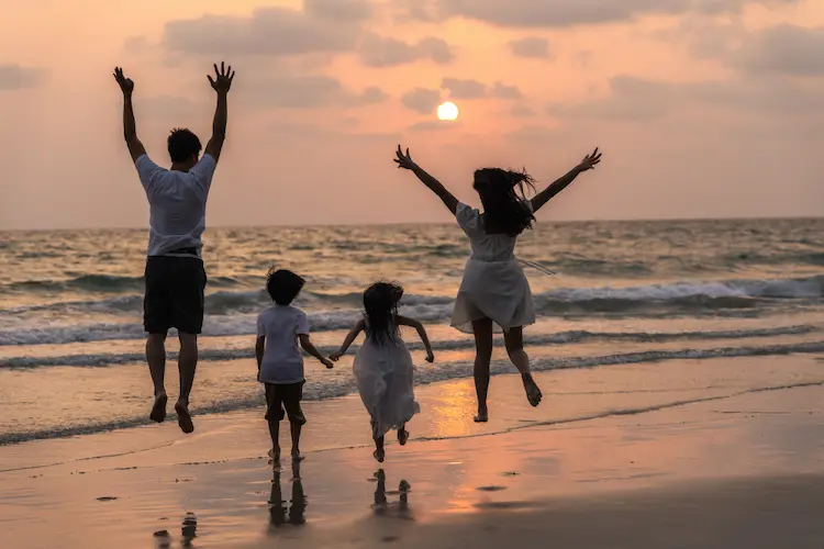 family jumping at beach at sunset

slow living quotes