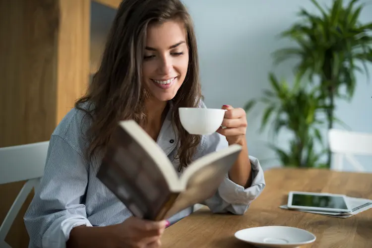 woman reading book with cup of tea
how can reading change your life