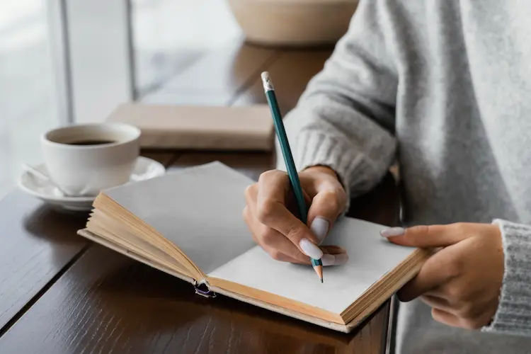 woman writing in notebook
hobbies for minimalists