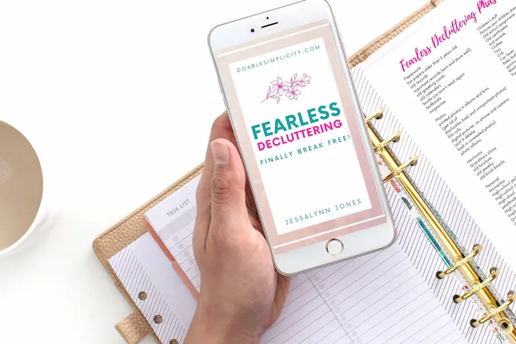 fearless decluttering ebook on phone and notebook binder with printables