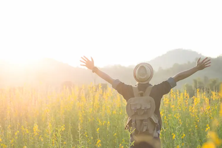 freedom relaxation happy man in field hiking nature