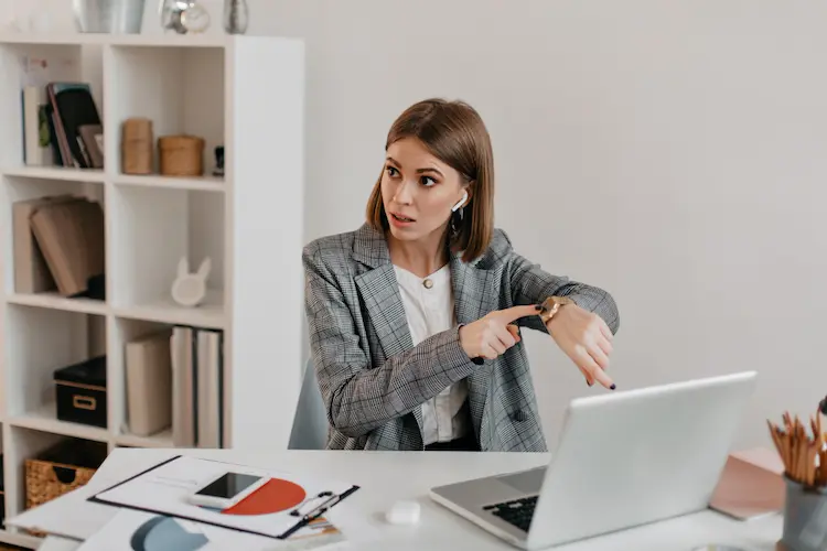 lady boss pointing at watch time management