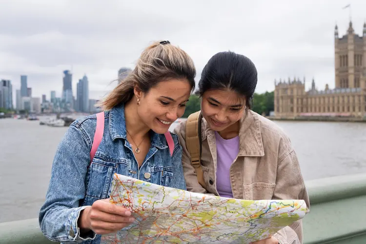 traveling happy women looking at map