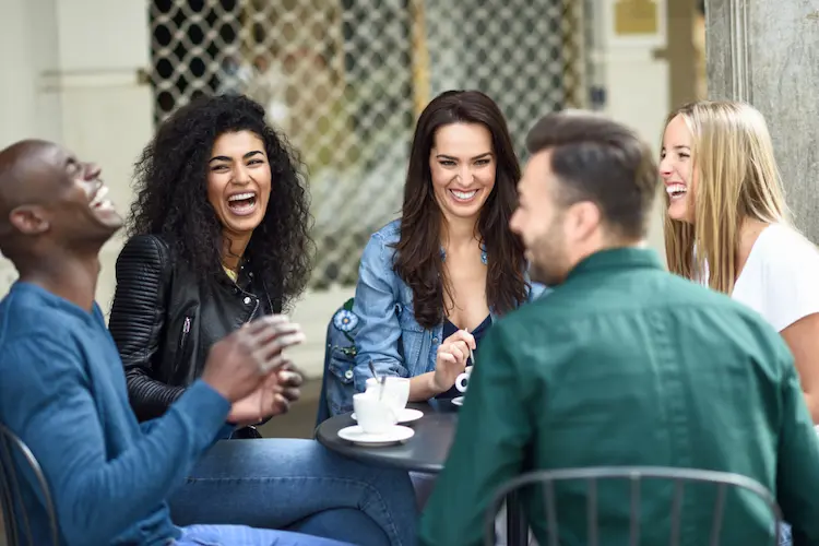 multi-racial 5 friends having coffee together