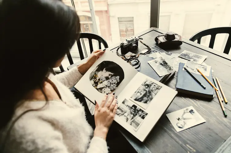 woman looking at black and white photo album

how to let go of sentimental items
