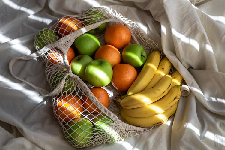 string bags with fruits sunbeams