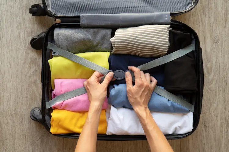 packing clothes in suitcase

minimalist packing list