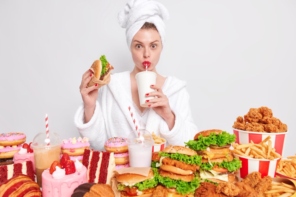 woman eating junk good not healthy towel on head 

the power of changing your habits 