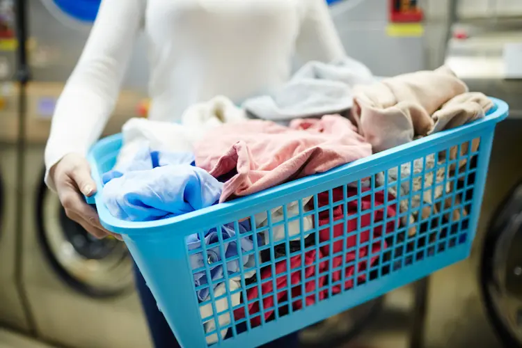 woman full laundry basket